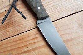 Slim and sharp utility knife in O1 carbon and linen micarta with black leather sheath.